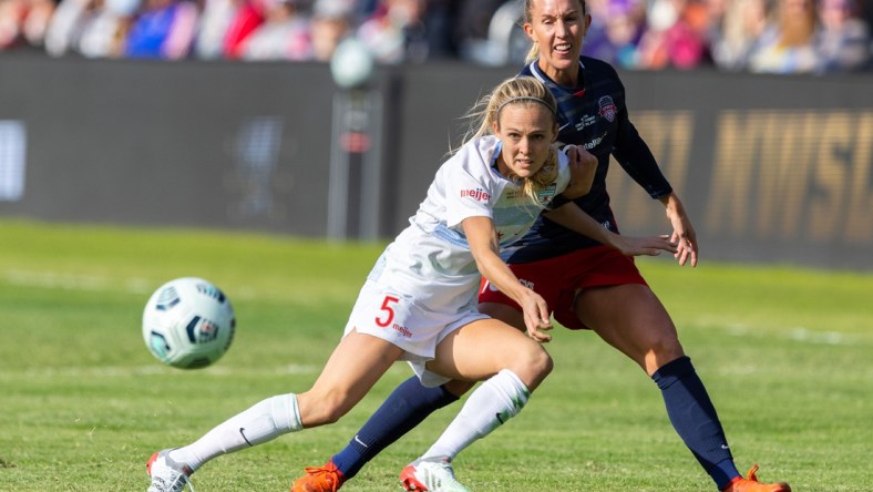 Nov 20, 2021; Louisville, Kentucky, USA; Chicago Red Stars forward Rachel Hill (5) passes the ball against Washington Spirit midfielder Julia Roddar (16) during the NWSL Championship match against the Chicago Red Stars at Lynn Family Stadium. Mandatory Credit: Jordan Prather-USA TODAY Sports