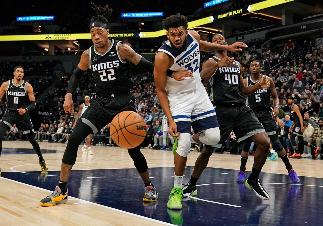 Nov 17, 2021; Minneapolis, Minnesota, USA;  Sacramento Kings center Richaun Holmes (22) and Minnesota Timberwolves center Karl-Anthony Towns (32) at Target Center. Mandatory Credit: Nick Wosika-USA TODAY Sports