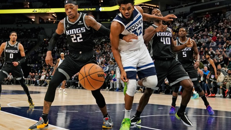 Nov 17, 2021; Minneapolis, Minnesota, USA;  Sacramento Kings center Richaun Holmes (22) and Minnesota Timberwolves center Karl-Anthony Towns (32) at Target Center. Mandatory Credit: Nick Wosika-USA TODAY Sports