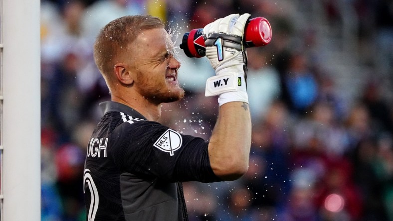 Nov 25, 2021; Commerce City, CO, USA; Colorado Rapids goalkeeper William Yarbrough (22) cools off with a water bottle during the second half against the Portland Timbers at Dick's Sporting Goods Park. Mandatory Credit: Ron Chenoy-USA TODAY Sports