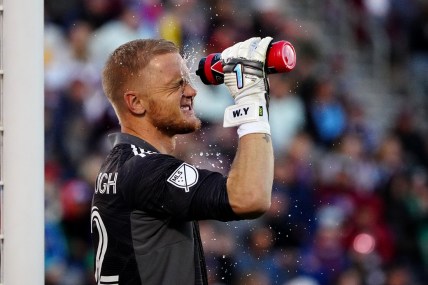 Nov 25, 2021; Commerce City, CO, USA; Colorado Rapids goalkeeper William Yarbrough (22) cools off with a water bottle during the second half against the Portland Timbers at Dick's Sporting Goods Park. Mandatory Credit: Ron Chenoy-USA TODAY Sports