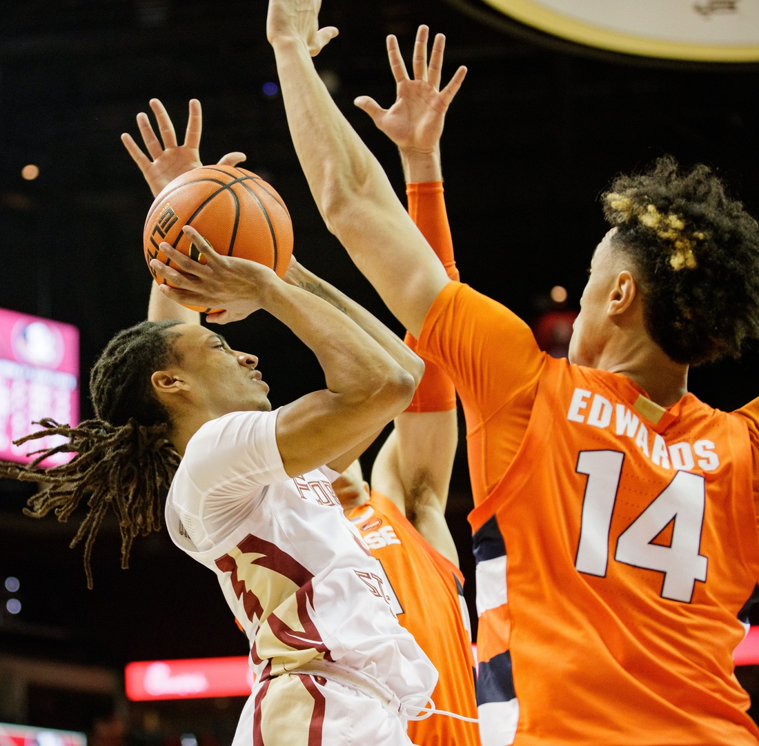 Florida State Seminoles guard Caleb Mills (4) shoots for two. The Florida State Seminoles lead the Syracuse Orange 32-24 at the half Saturday, Dec. 4, 2021.

Fsu V Syracuse Mens Basketball057