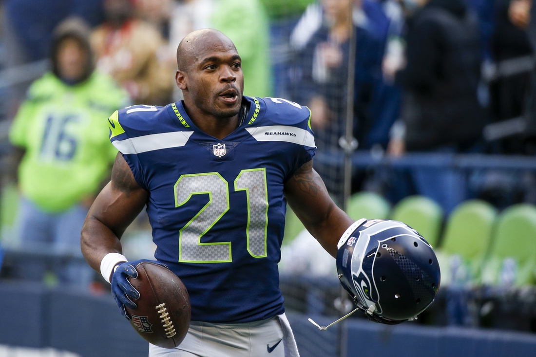 Dec 5, 2021; Seattle, Washington, USA; Seattle Seahawks running back Adrian Peterson (21) returns to the locker room following pregame warmups against the San Francisco 49ers at Lumen Field. Mandatory Credit: Joe Nicholson-USA TODAY Sports