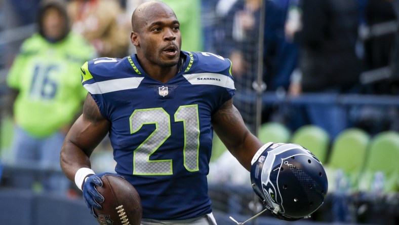 Dec 5, 2021; Seattle, Washington, USA; Seattle Seahawks running back Adrian Peterson (21) returns to the locker room following pregame warmups against the San Francisco 49ers at Lumen Field. Mandatory Credit: Joe Nicholson-USA TODAY Sports