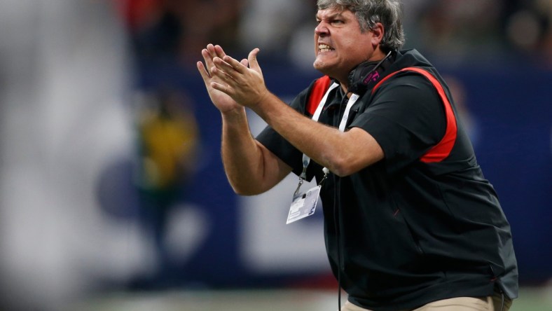 Georgia offensive line coach Matt Luke on the sideline during the first half of the Southeastern Conference championship NCAA college football game between Georgia and Alabama in Atlanta, on Saturday, Dec. 4, 2021.

News Joshua L Jones