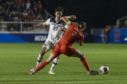 Dec 10, 2021; Cary, NC, USA; Clemson defender Oskar   gren (3) tries to deflect the dribble from Notre Dame forward Jack Lynn (27) during the second half of the NCAA College Cup semifinal game at WakeMed Soccer Park. Mandatory Credit: William Howard-USA TODAY Sports