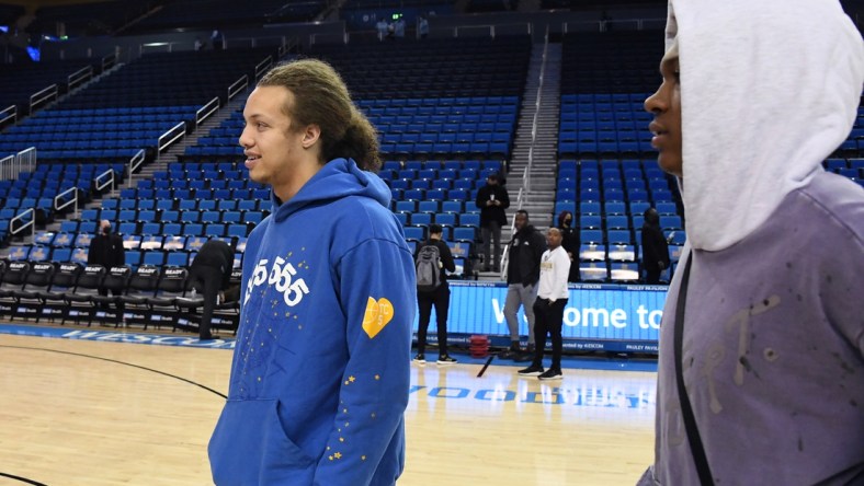 Dec 15, 2021; Los Angeles, California, USA; UCLA Bruins forward Mac Etienne (left) and guard Jaylen Clark (right) look on after the game against the Alabama State Hornets was cancelled due to COVID-19 protocols at Pauley Pavilion presented by Wescom. Mandatory Credit: Richard Mackson-USA TODAY Sports