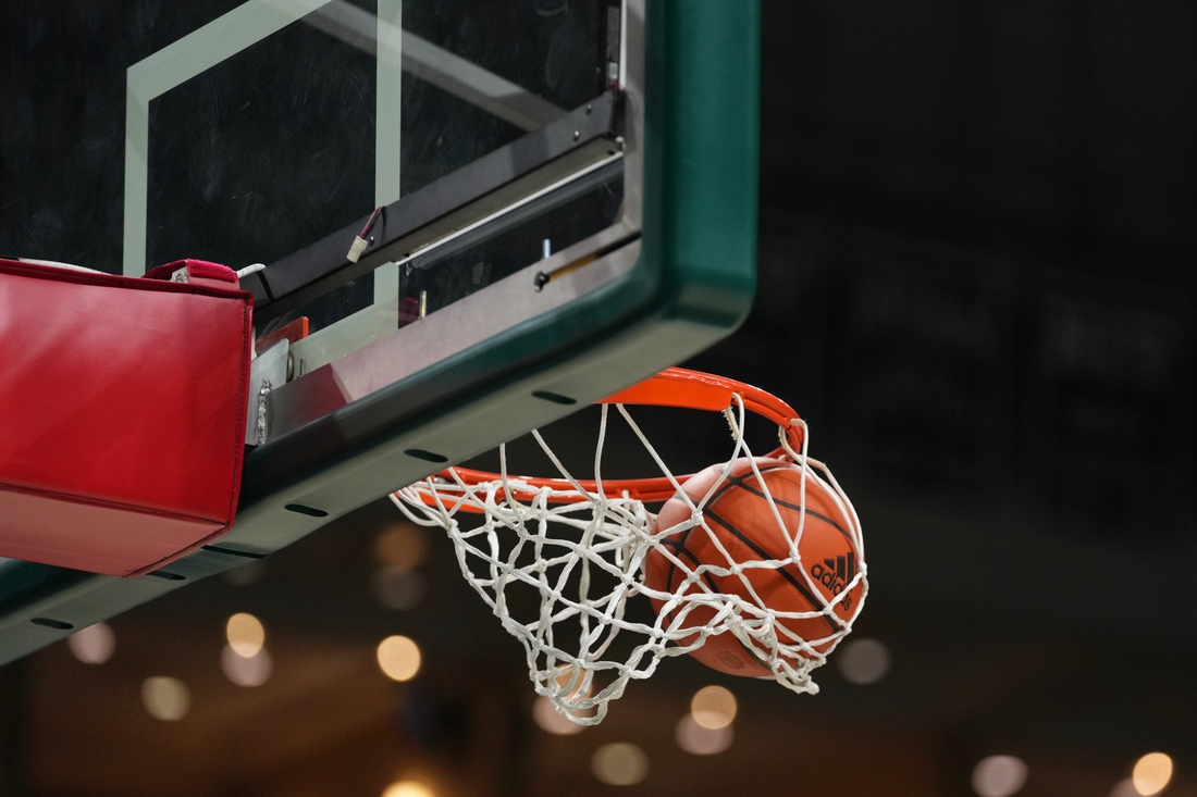 Dec 20, 2021; Coral Gables, Florida, USA; A general view as a basketball goes through the hoop as the Stetson Hatters warm up prior to the game against the Miami Hurricanes at Watsco Center. Mandatory Credit: Jasen Vinlove-USA TODAY Sports