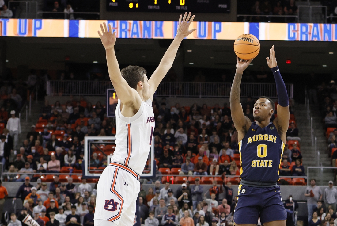 Dec 22, 2021; Auburn, Alabama, USA;  Murray State Racers forward KJ Williams (0) shoots over Auburn Tigers forward Jabari Smith (10) during the first half at Auburn Arena. Mandatory Credit: John Reed-USA TODAY Sports