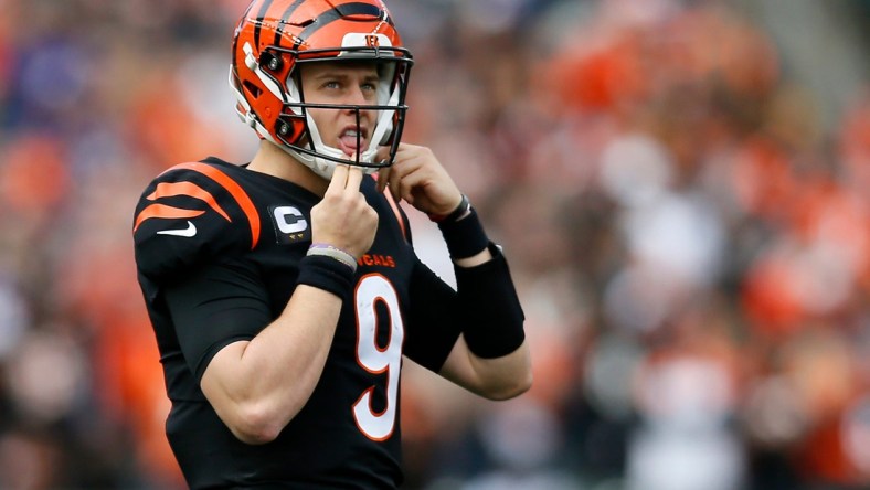 Cincinnati Bengals quarterback Joe Burrow (9) peeks up to the video board as he returns to the line in the second quarter of the NFL Week 16 game between the Cincinnati Bengals and the Baltimore Ravens at Paul Brown Stadium in downtown Cincinnati on Sunday, Dec. 26, 2021. The Bengals led 31-14 at halftime.

Baltimore Ravens At Cincinnati Bengals Week 16