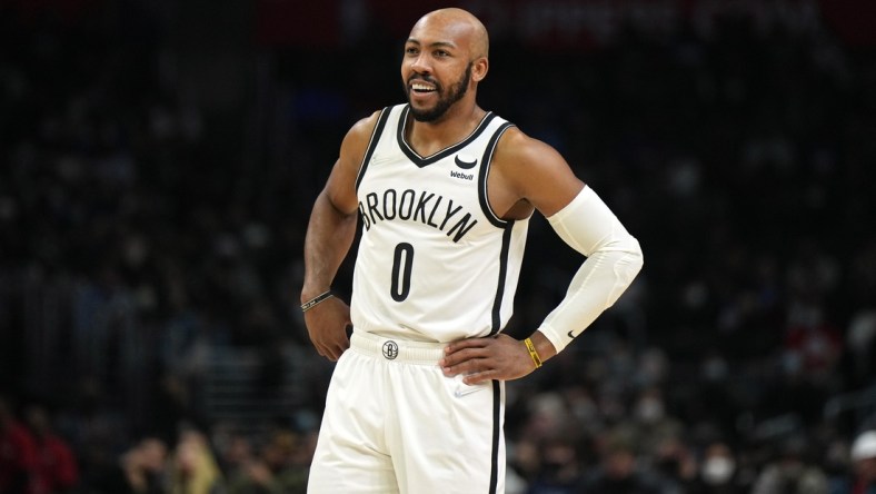 Dec 27, 2021; Los Angeles, California, USA; Brooklyn Nets guard Jevon Carter (0) reacts against the LA Clippers in the second half at Crypto.com Arena. Mandatory Credit: Kirby Lee-USA TODAY Sports