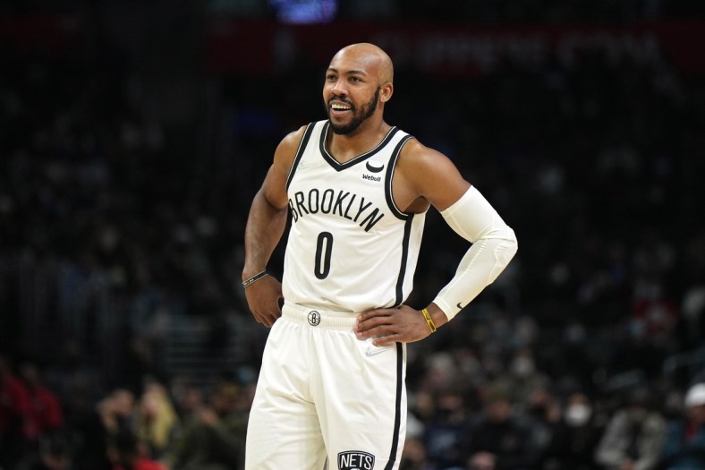 Dec 27, 2021; Los Angeles, California, USA; Brooklyn Nets guard Jevon Carter (0) reacts against the LA Clippers in the second half at Crypto.com Arena. Mandatory Credit: Kirby Lee-USA TODAY Sports