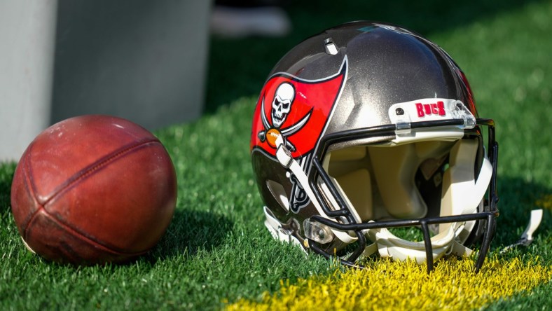 Dec 26, 2021; Charlotte, North Carolina, USA; Tampa Bay Buccaneers helmet and ball during the first quarter between the Carolina Panthers and the Tampa Bay Buccaneers at Bank of America Stadium. Mandatory Credit: Jim Dedmon-USA TODAY Sports