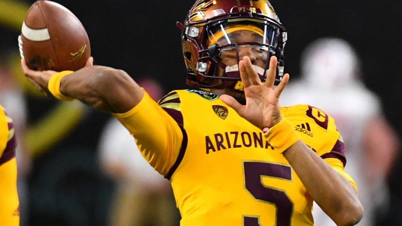 Dec 30, 2021; Paradise, Nevada, USA; Arizona State Sun Devils quarterback Jayden Daniels (5) warms up before facing the Wisconsin Badgers in the 2021 Las Vegas Bowl at Allegiant Stadium. Mandatory Credit: Stephen R. Sylvanie-USA TODAY Sports