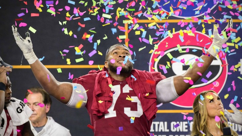 Dec 31, 2021; Arlington, Texas, USA; Alabama Crimson Tide offensive lineman Evan Neal (73) celebrates the win over the Cincinnati Bearcats after the 2021 Cotton Bowl college football CFP national semifinal game at AT&T Stadium. Mandatory Credit: Jerome Miron-USA TODAY Sports