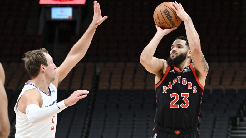 Dec 31, 2021; Toronto, Ontario, CAN; Toronto Raptors guard Fred VanVleet (23) shoots the ball against Los Angeles Clippers guard Luke Kennard (5) in the first half at Scotiabank Arena. Mandatory Credit: Dan Hamilton-USA TODAY Sports