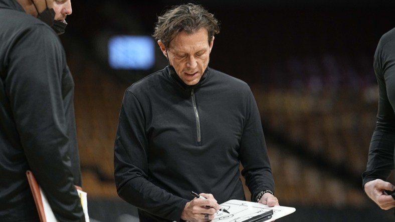 Jan 7, 2022; Toronto, Ontario, CAN; Utah Jazz head coach Quin Snyder draws up a play during a break in the action against the Toronto Raptors during the first half at Scotiabank Arena. Mandatory Credit: John E. Sokolowski-USA TODAY Sports