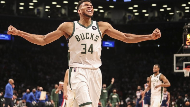 Jan 7, 2022; Brooklyn, New York, USA;  Milwaukee Bucks forward Giannis Antetokounmpo (34) celebrates after the Brooklyn Nets call a time out in the fourth quarter at Barclays Center. Mandatory Credit: Wendell Cruz-USA TODAY Sports