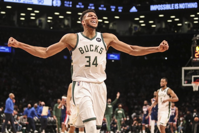 Jan 7, 2022; Brooklyn, New York, USA;  Milwaukee Bucks forward Giannis Antetokounmpo (34) celebrates after the Brooklyn Nets call a time out in the fourth quarter at Barclays Center. Mandatory Credit: Wendell Cruz-USA TODAY Sports