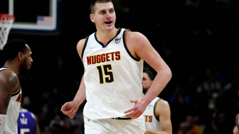 Jan 7, 2022; Denver, Colorado, USA; Denver Nuggets center Nikola Jokic (15) reacts after his score in the second half against the Sacramento Kings at Ball Arena. Mandatory Credit: Ron Chenoy-USA TODAY Sports