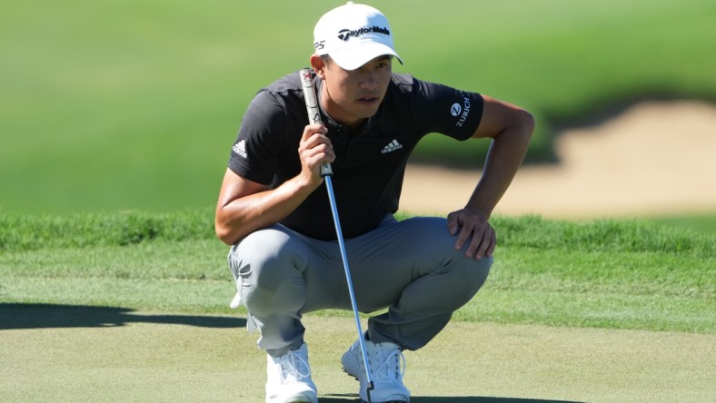 January 8, 2022; Maui, Hawaii, USA; Collin Morikawa lines up his putt on the 13th hole during the third round of the Sentry Tournament of Champions golf tournament at Kapalua Resort - The Plantation Course. Mandatory Credit: Kyle Terada-USA TODAY Sports