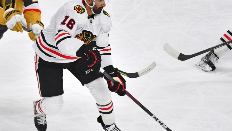 Jan 8, 2022; Las Vegas, Nevada, USA;  Chicago Blackhawks left wing Jujhar Khaira (16) skates with the puck during the second period against the Vegas Golden Knights at T-Mobile Arena. Mandatory Credit: Stephen R. Sylvanie-USA TODAY Sports