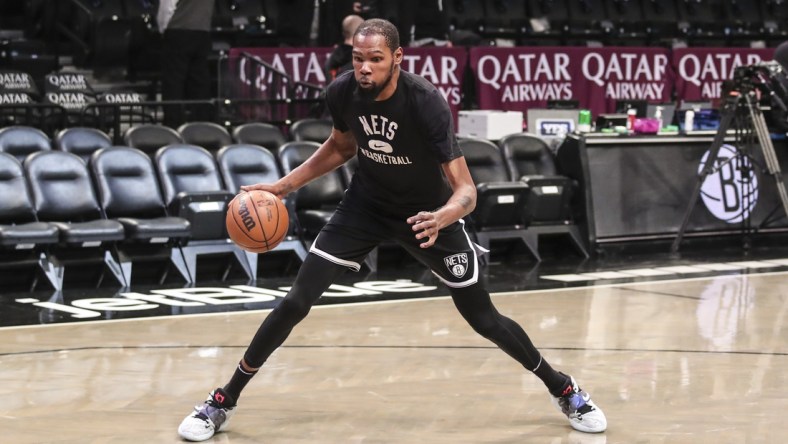 Jan 13, 2022; Brooklyn, New York, USA;  Brooklyn Nets forward Kevin Durant (7) takes warmups prior to the game against the Oklahoma City Thunder at Barclays Center. Mandatory Credit: Wendell Cruz-USA TODAY Sports