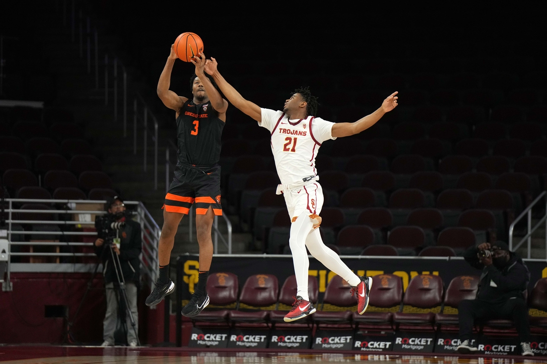 Jan 13, 2022; Los Angeles, California, USA; Oregon State guard Beavers Dexter Akanno (3) catches an inbounds pass as Southern California Trojans guard Reese Dixon-Waters (21) defends in the second half at Galen Center. USC defeated OSU 81-71. Mandatory Credit: Kirby Lee-USA TODAY Sports