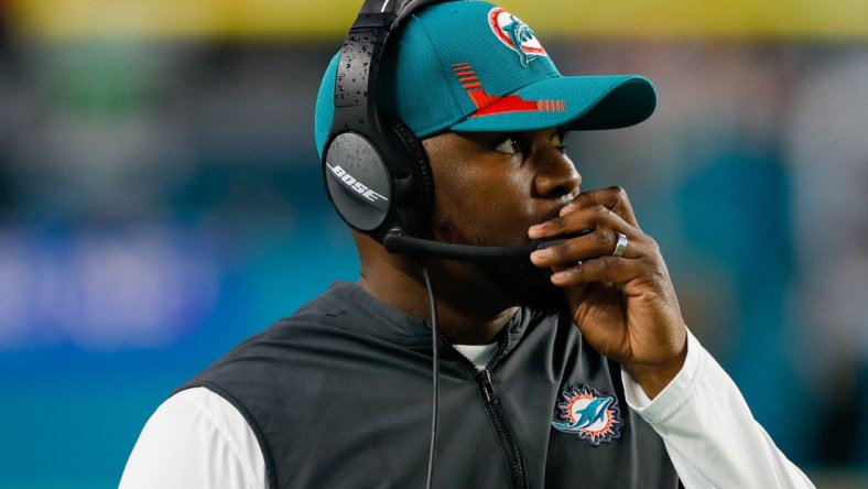 Jan 9, 2022; Miami Gardens, Florida, USA; Miami Dolphins head coach Brian Flores watches from the sideline during the second quarter of the game against the New England Patriots at Hard Rock Stadium. Mandatory Credit: Sam Navarro-USA TODAY Sports