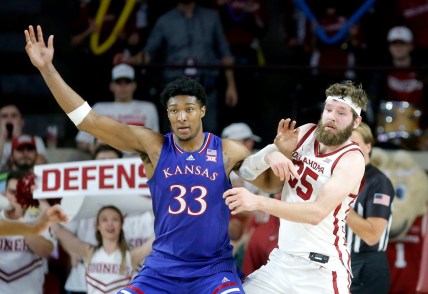 Oklahoma's Tanner Groves (35) defends against Kansas' David McCormack (33) in the second half during the men's college basketball game between the Oklahoma Sooners and the Kansas Jayhawks at the Lloyd Noble Center in Norman, Okla., Tuesday, Jan. 18, 2022.

Ou Mbb Vs Ku