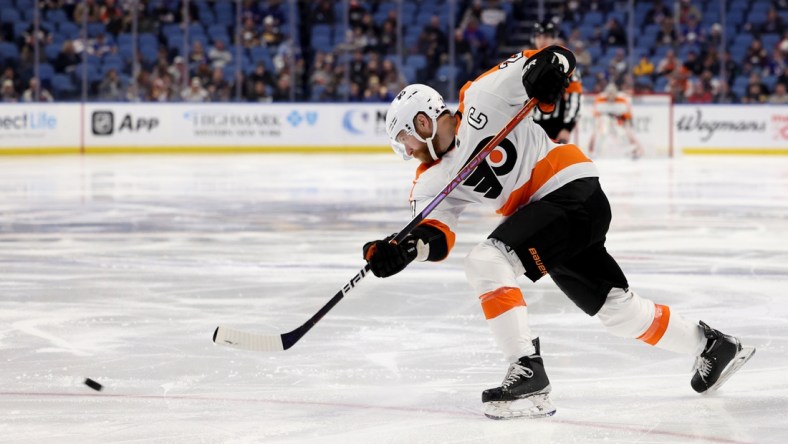 Jan 22, 2022; Buffalo, New York, USA;  Philadelphia Flyers center Claude Giroux (28) takes a shot on goal during the third period against the Buffalo Sabres at KeyBank Center. Mandatory Credit: Timothy T. Ludwig-USA TODAY Sports