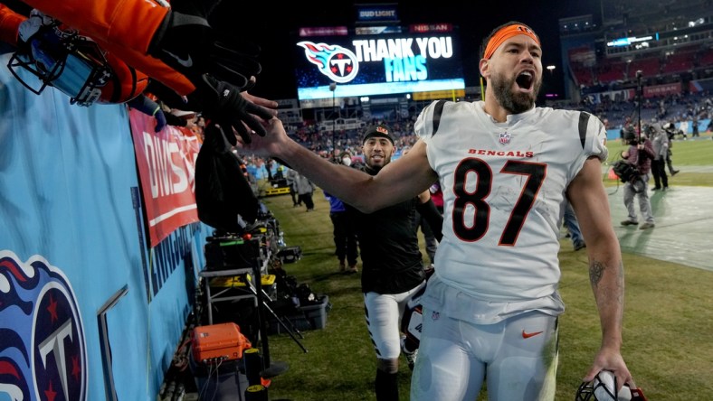 Jan 22, 2022; Nashville, Tennessee, USA; Cincinnati Bengals tight end C.J. Uzomah (87) celebrates after the Bengals defeated the Tennessee Titans 19-16 during the AFC Divisional playoff football game at Nissan Stadium. Mandatory Credit: Kirby Lee-USA TODAY Sports