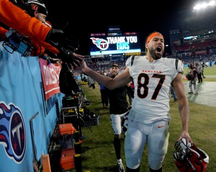 Jan 22, 2022; Nashville, Tennessee, USA; Cincinnati Bengals tight end C.J. Uzomah (87) celebrates after the Bengals defeated the Tennessee Titans 19-16 during the AFC Divisional playoff football game at Nissan Stadium. Mandatory Credit: Kirby Lee-USA TODAY Sports