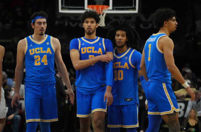 Jan 22, 2022; Boulder, Colorado, USA; UCLA Bruins guard Jaime Jaquez Jr. (24) and guard Johnny Juzang (3) and guard Tyger Campbell (10) and guard Jules Bernard (1) react during the second half against the Colorado Buffaloes at the CU Events Center. Mandatory Credit: Ron Chenoy-USA TODAY Sports
