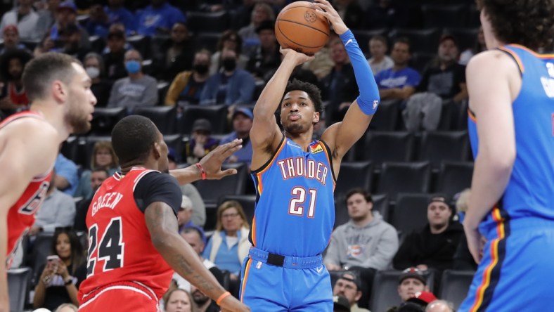 Jan 24, 2022; Oklahoma City, Oklahoma, USA; Oklahoma City Thunder guard Aaron Wiggins (21) shoots as Chicago Bulls forward Javonte Green (24) defends during the first quarter at Paycom Center. Mandatory Credit: Alonzo Adams-USA TODAY Sports