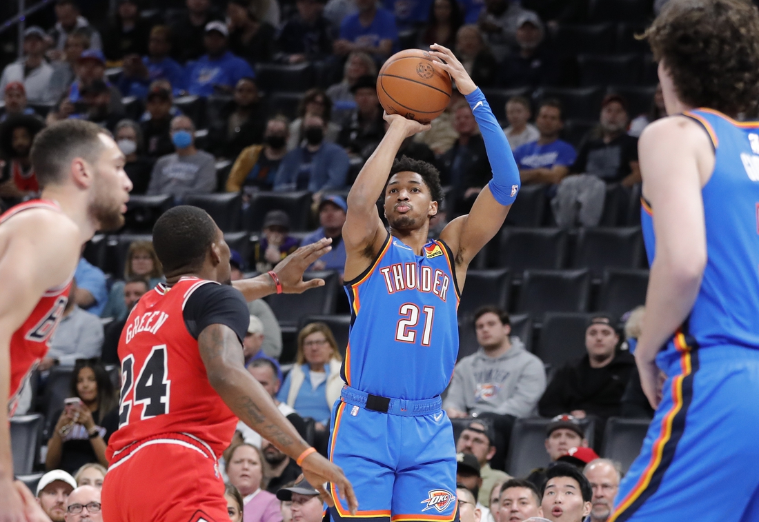 Jan 24, 2022; Oklahoma City, Oklahoma, USA; Oklahoma City Thunder guard Aaron Wiggins (21) shoots as Chicago Bulls forward Javonte Green (24) defends during the first quarter at Paycom Center. Mandatory Credit: Alonzo Adams-USA TODAY Sports