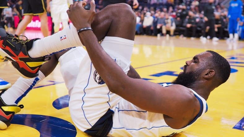 Jan 25, 2022; San Francisco, California, USA; Dallas Mavericks guard Tim Hardaway Jr. (11) on the court after an injury during the second quarter against the Golden State Warriors at Chase Center. Mandatory Credit: Kelley L Cox-USA TODAY Sports