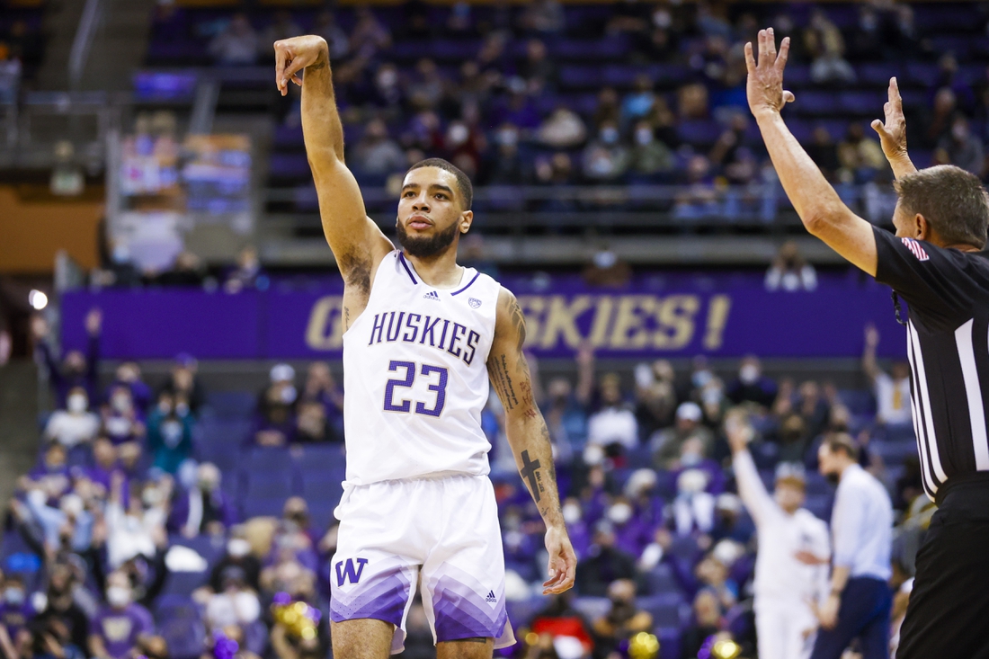 Jan 29, 2022; Seattle, Washington, USA; Washington Huskies guard Terrell Brown Jr. (23) reacts after making a three-pointer to end the first half against the Utah Utes at Alaska Airlines Arena at Hec Edmundson Pavilion. Mandatory Credit: Joe Nicholson-USA TODAY Sports