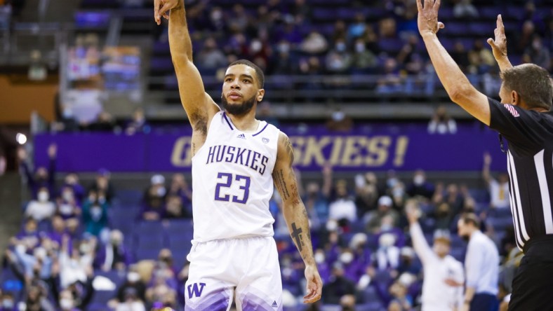 Jan 29, 2022; Seattle, Washington, USA; Washington Huskies guard Terrell Brown Jr. (23) reacts after making a three-pointer to end the first half against the Utah Utes at Alaska Airlines Arena at Hec Edmundson Pavilion. Mandatory Credit: Joe Nicholson-USA TODAY Sports