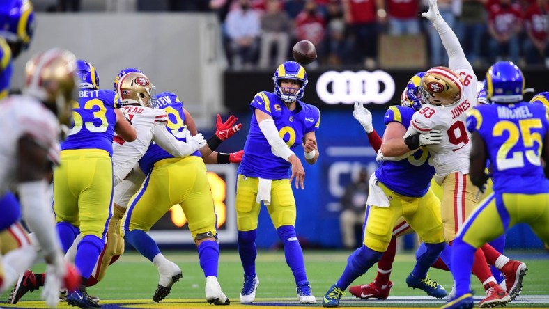 Jan 30, 2022; Inglewood, California, USA; Los Angeles Rams quarterback Matthew Stafford (9) throws a pass against the San Francisco 49ers in the first half during the NFC Championship Game at SoFi Stadium. Mandatory Credit: Gary A. Vasquez-USA TODAY Sports