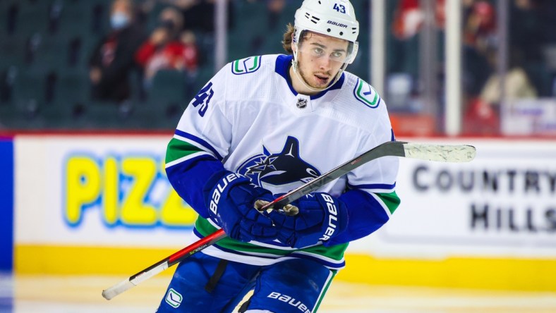 Jan 29, 2022; Calgary, Alberta, CAN; Vancouver Canucks defenseman Quinn Hughes (43) skates against the Calgary Flames during the third period at Scotiabank Saddledome. Mandatory Credit: Sergei Belski-USA TODAY Sports