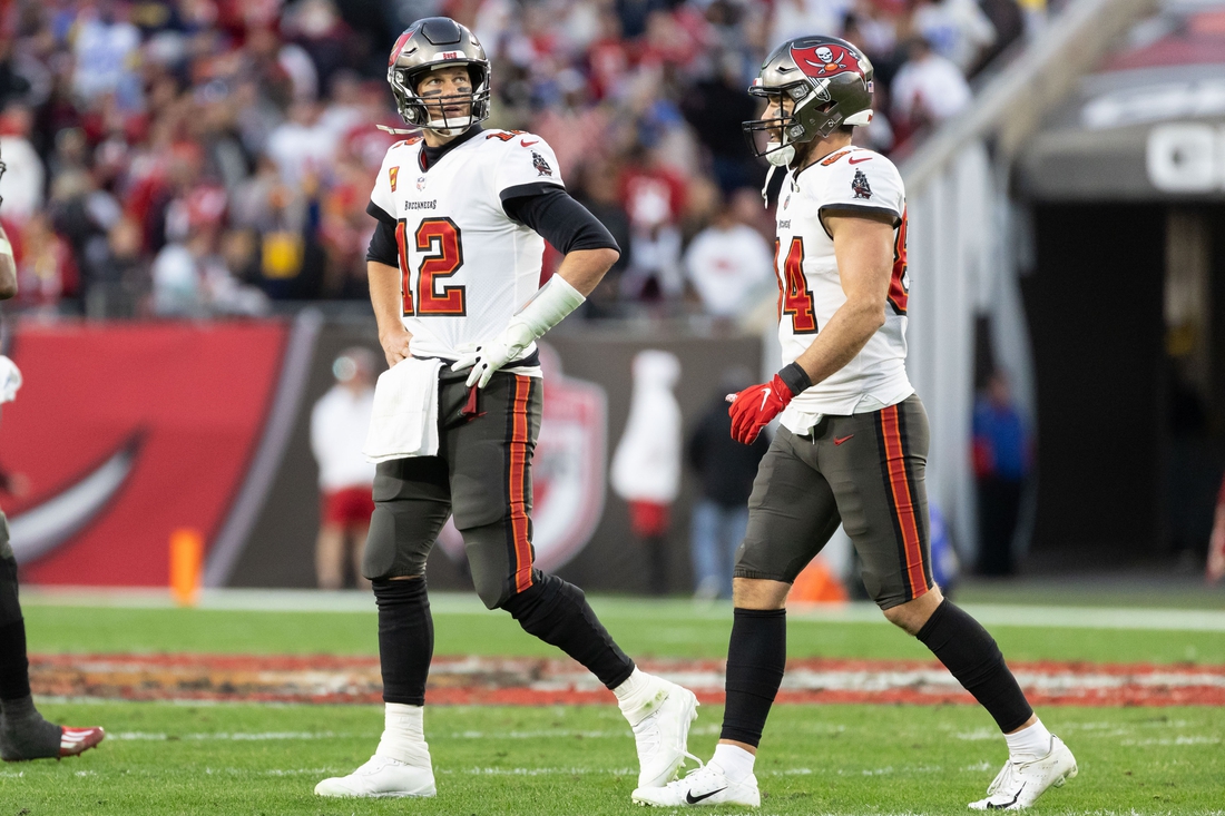 Jan 23, 2022; Tampa, Florida, USA; Tampa Bay Buccaneers quarterback Tom Brady (12) walks off the field looking at the scoreboard during the second half against the Los Angeles Rams during a NFC Divisional playoff football game at Raymond James Stadium. Mandatory Credit: Matt Pendleton-USA TODAY Sports