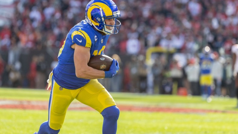 Jan 23, 2022; Tampa, Florida, USA; Los Angeles Rams wide receiver Cooper Kupp (10) runs with the ball during the first half against the Tampa Bay Buccaneers during a NFC Divisional playoff football game at Raymond James Stadium. Mandatory Credit: Matt Pendleton-USA TODAY Sports