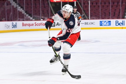 Jan 30, 2022; Montreal, Quebec, CAN; Columbus Blue Jackets defenseman Jake Bean (22) shoots the puck during the first period at Bell Centre. Mandatory Credit: David Kirouac-USA TODAY Sports