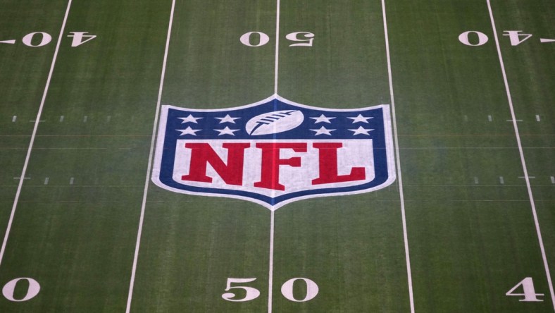 Feb 1, 2022; Inglewood, CA, USA; The NFL shield logo is seen at midfield at SoFi Stadium. Super Bowl LVI between the Los Angeles Rams and the Cincinnati Bengals will be played on Feb. 13, 2022. Mandatory Credit: Kirby Lee-USA TODAY Sports