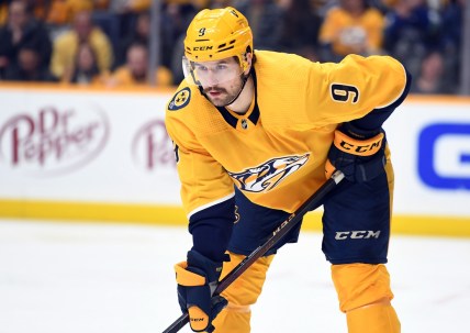 Feb 1, 2022; Nashville, Tennessee, USA; Nashville Predators left wing Filip Forsberg (9) waits for a face off during the second period against the Vancouver Canucks at Bridgestone Arena. Mandatory Credit: Christopher Hanewinckel-USA TODAY Sports