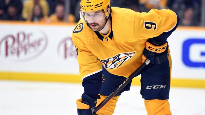 Feb 1, 2022; Nashville, Tennessee, USA; Nashville Predators left wing Filip Forsberg (9) waits for a face off during the second period against the Vancouver Canucks at Bridgestone Arena. Mandatory Credit: Christopher Hanewinckel-USA TODAY Sports