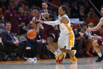 Feb 1, 2022; Knoxville, Tennessee, USA; Tennessee Volunteers guard Zakai Zeigler (5) forces a turnover against Texas A&M Aggies guard Wade Taylor IV (4) during the second half at Thompson-Boling Arena. Mandatory Credit: Randy Sartin-USA TODAY Sports