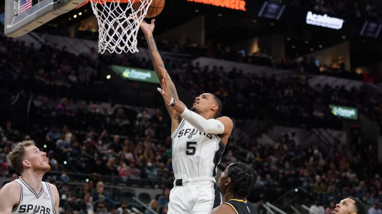 Feb 1, 2022; San Antonio, Texas, USA;  San Antonio Spurs guard Dejounte Murray (5) shoots in the first half against the Golden State Warriors at the AT&T Center. Mandatory Credit: Daniel Dunn-USA TODAY Sports