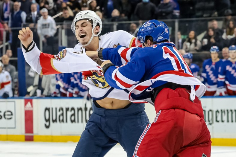 Feb 1, 2022; New York, New York, USA; Florida Panthers left wing Mason Marchment (17) fights New York Rangers center Ryan Strome (16) during the third period at Madison Square Garden. Mandatory Credit: Vincent Carchietta-USA TODAY Sports
